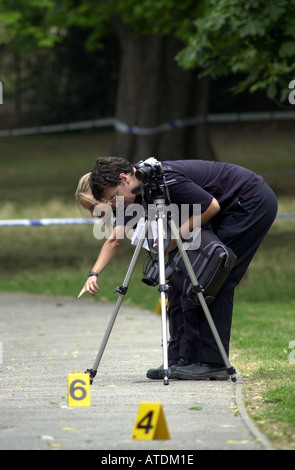 Scene of crime team examines the evidence UK Stock Photo