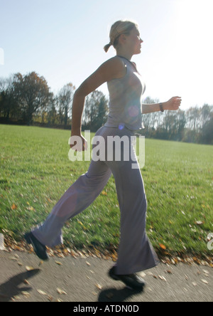 young woman jogging in the park Stock Photo
