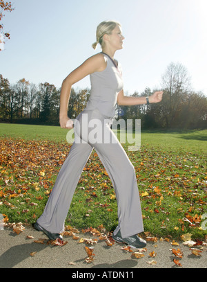 young woman jogging in the park Stock Photo