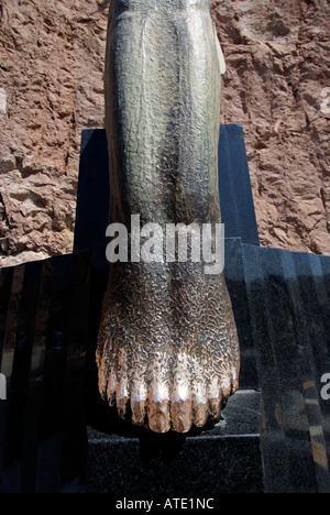 Rubbing the toes of the Winged figures brings good luck Hoover Dam Nevada and Arizona USA Stock Photo