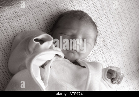 sleeping baby girl infant black and white horizontal cute crib kid family photo Stock Photo