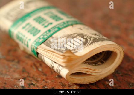 a roll of ten One Hundred dollar bills totaling US $1000 Stock Photo