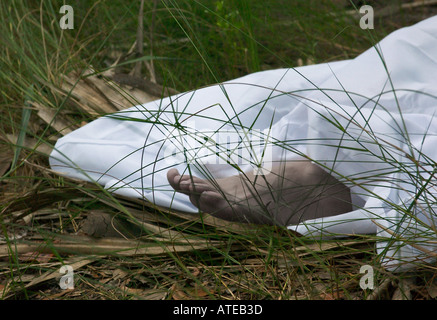 Foot of Caucasian Female Dead Body Protruding from Under Sheet USA, Crime Scene Stock Photo