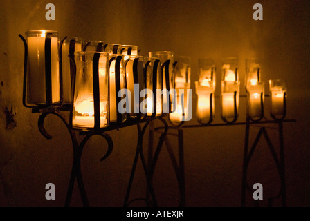 Lit prayer candles in the Loreto Chapel at the Presidio La Bahia del Espíritu Santo in Goliad Texas USA Stock Photo