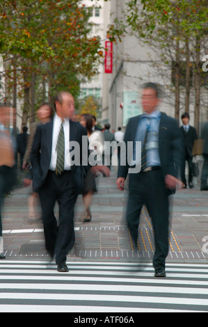 Businessmen walking on business district Marunouchi Ginza Tokyo Japan Stock Photo