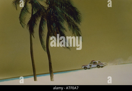 Hand colored and manipulated landscape of police car racing down the beach with palm trees Miami Beach Stock Photo