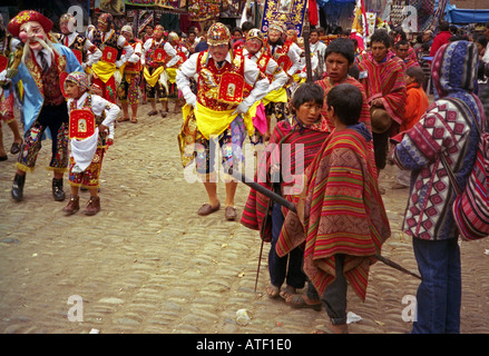 Indigenous people man boy in colourful costumes celebrate history dance act Inca ancestors Pisac Peru South Latin America Stock Photo