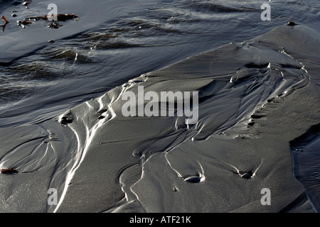 Rill marked patterns in the sand Stock Photo