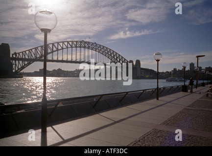 Panoramic view of the sun setting on the imposing iron Harbour Bridge Sydney Sidney New South Wales Australia Stock Photo