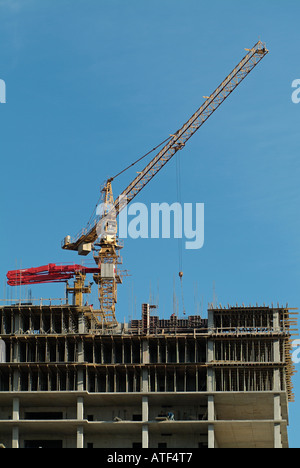 Crane on Top of Building Under Construction Stock Photo