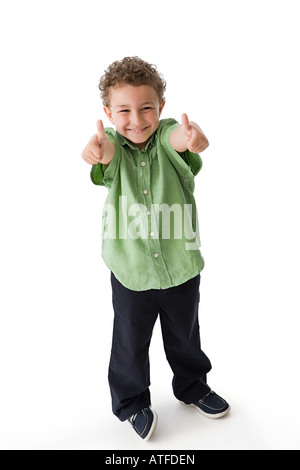 Young boy giving thumbs up smiling Stock Photo - Alamy
