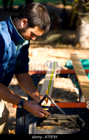 measuring a piece of wood Stock Photo