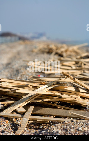 Ferring seafront beach pollution: huge quantities of timber washed up on the Sussex beach after winter storms. Stock Photo