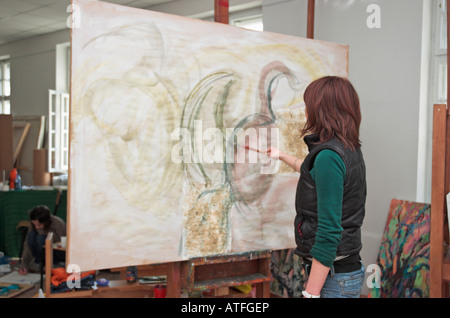 Young female art student painting Stock Photo
