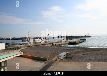 beacon in the harbour over the sea Yalta Crimea Stock Photo