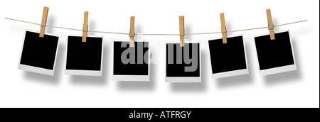Blank photo frames on a leash In front of a white background with clipping path Stock Photo