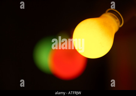 a row of coloured lightbulbs Stock Photo