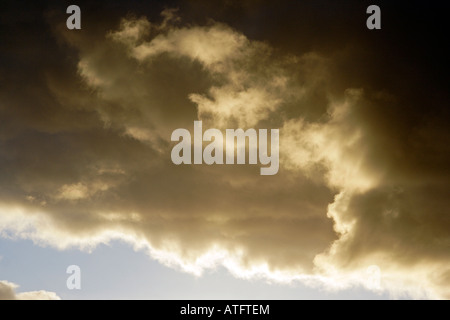 Dramatic clouds in the evening light Stock Photo