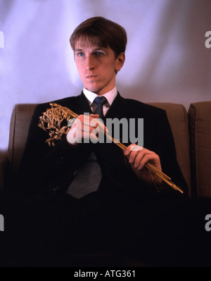 Man in a suit with bouquet Stock Photo