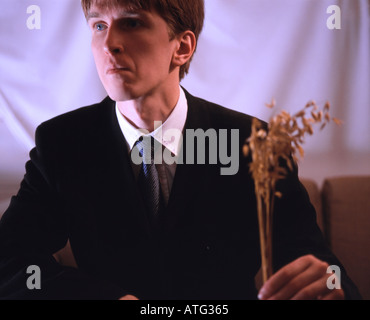 Man in a suit with bouquet Stock Photo