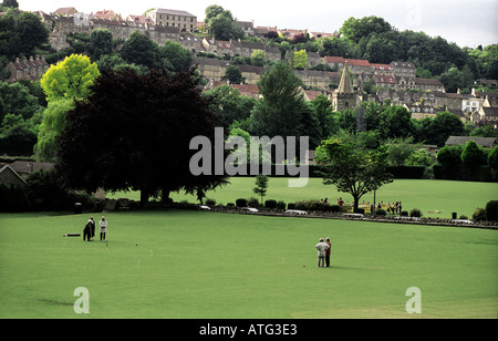 Traditional croquet match in progress with town of Bradford on Avon as backdrop Stock Photo