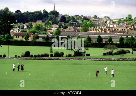 Traditional croquet match in progress with town of Bradford on Avon as backdrop Stock Photo
