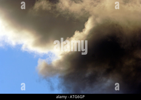 Dramatic clouds in the evening light Stock Photo