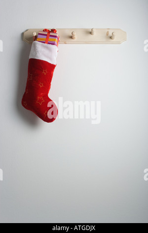 Christmas stocking hanging on a hook Stock Photo