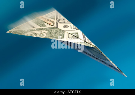 Paper aeroplane made of dollars Stock Photo