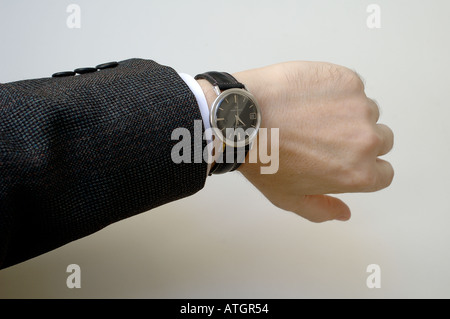 Businessman checking the time Stock Photo