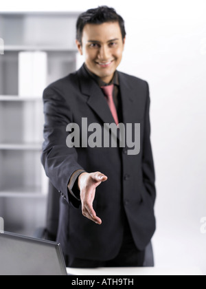 smiling businessman holding hand Stock Photo