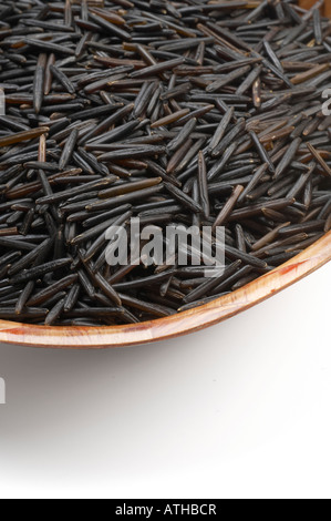 Wild Rice in bowl on white background Stock Photo