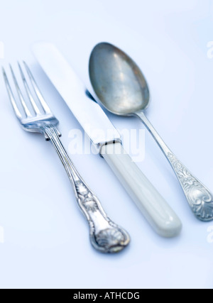 Vintage knives forks and spoon shot on a white background Stock Photo