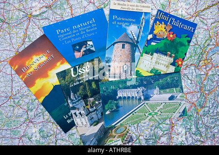 French tourist brochures scattered on map of France Stock Photo - Alamy