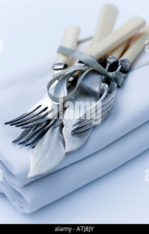 Vintage knives and forks with napkins Stock Photo