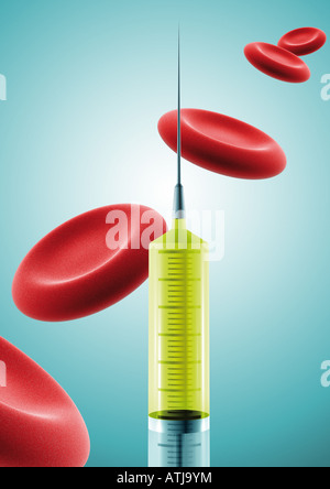 syringe and blood platelets Spritze und Blutplättchen Stock Photo