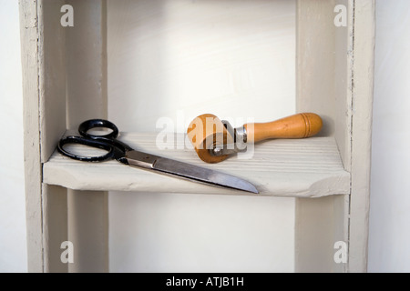 Retro style shot of stepladders - with sissors and a wooden wallpaper roller. Stock Photo
