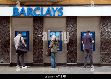 People withdrawing money from Barclays bank cash point machines, London, England, UK Stock Photo