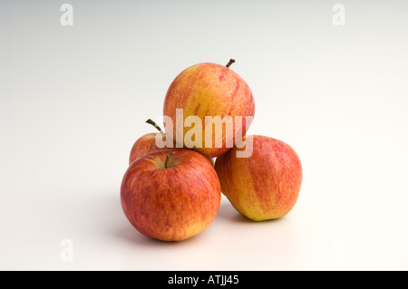 A mound of four Gala apples on a white background Stock Photo