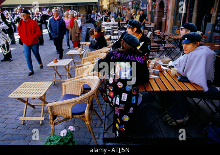 People at a street cafe in a cobbled square on the Gamla Stan Island in Stockholm Stock Photo