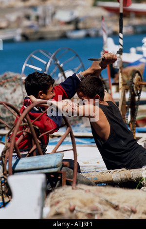 Young boys having a fight in Saida Lebanon Stock Photo