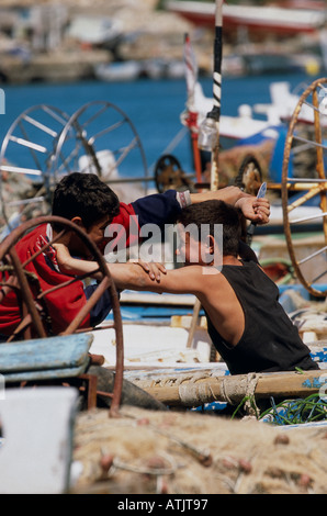 Young boys having a fight in Saida Lebanon Stock Photo