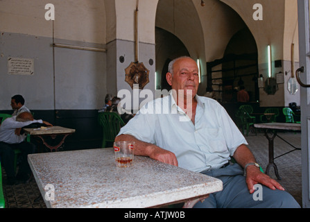 An elderly man relaxing at a cafe in Tyre Lebanon Stock Photo