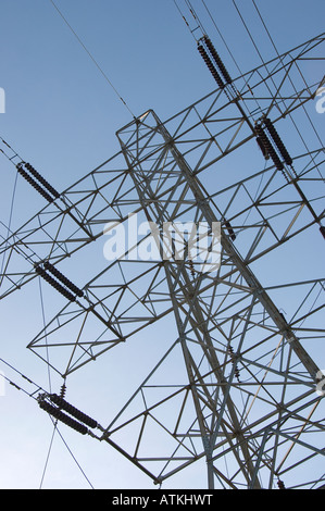 Electricity pylon against blue sky England UK United Kingdom GB Great Britain Stock Photo