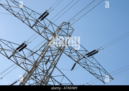 Electricity pylon against blue sky England UK United Kingdom GB Great Britain Stock Photo