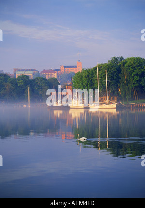 Boats anchored at Skeppsholmen at sunrise in Stockholm Stock Photo