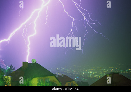 A lightning strike appears to strike a house in Budapest, Hungary, during a summer thunderstorm Stock Photo