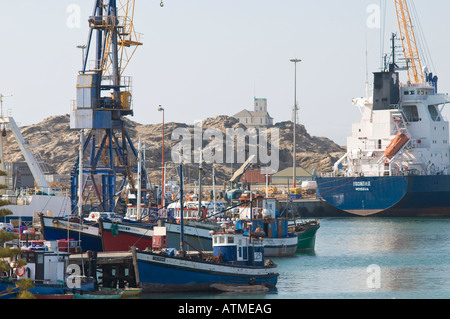 Luderitz harbour in Namibia with a container ship loading at this African port Stock Photo