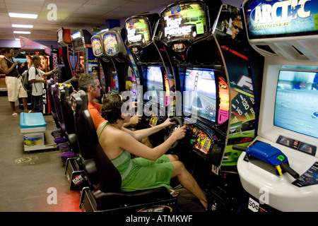 Having fun at an arcade video game at Coney Island Brooklyn, New York Stock Photo