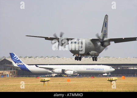 Spartan C 27 J coming in to land with Airbus A340 600 in background Stock Photo